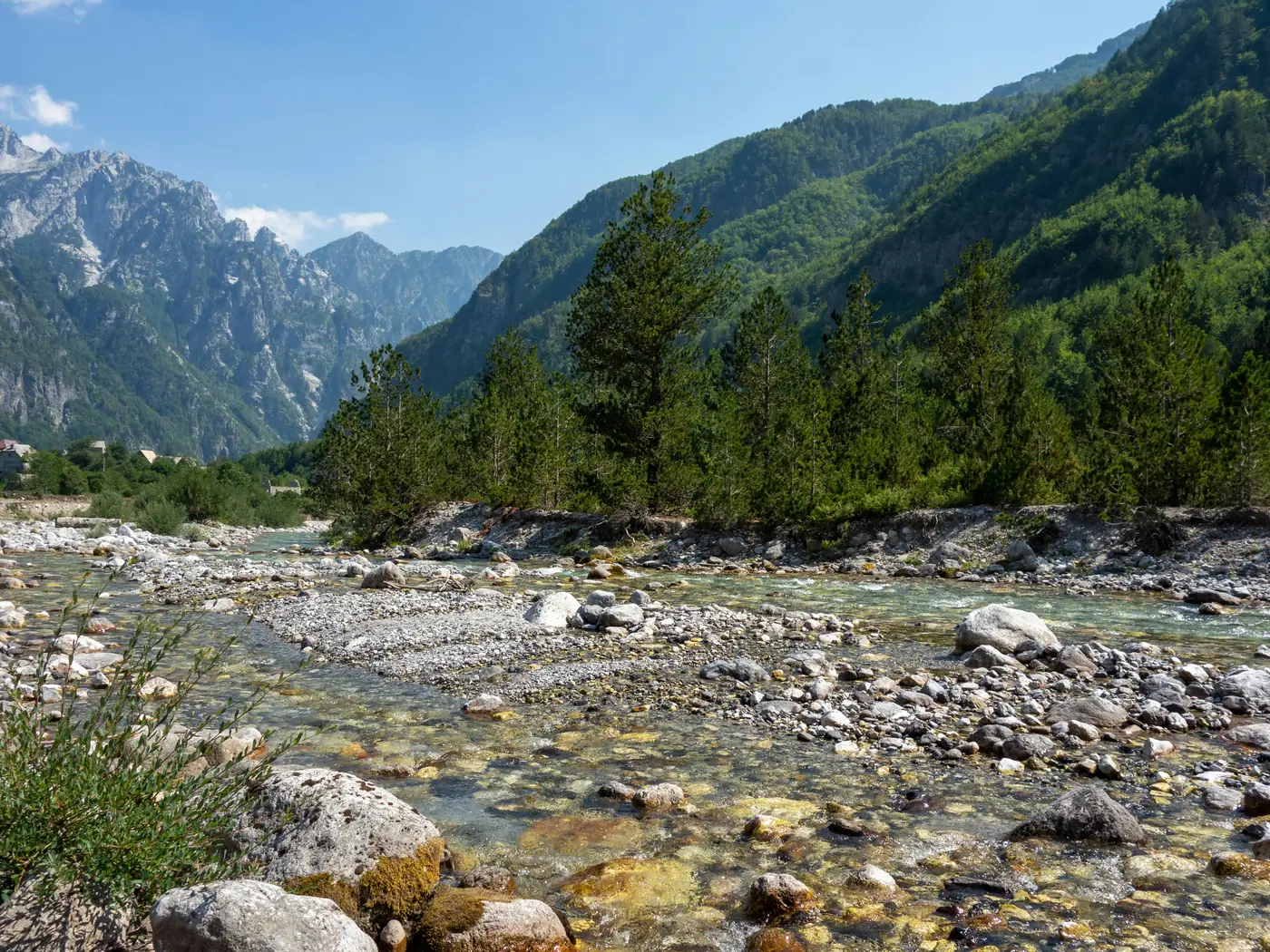 Guesthouse and stone church in the Theth valley below the Albanian Alps